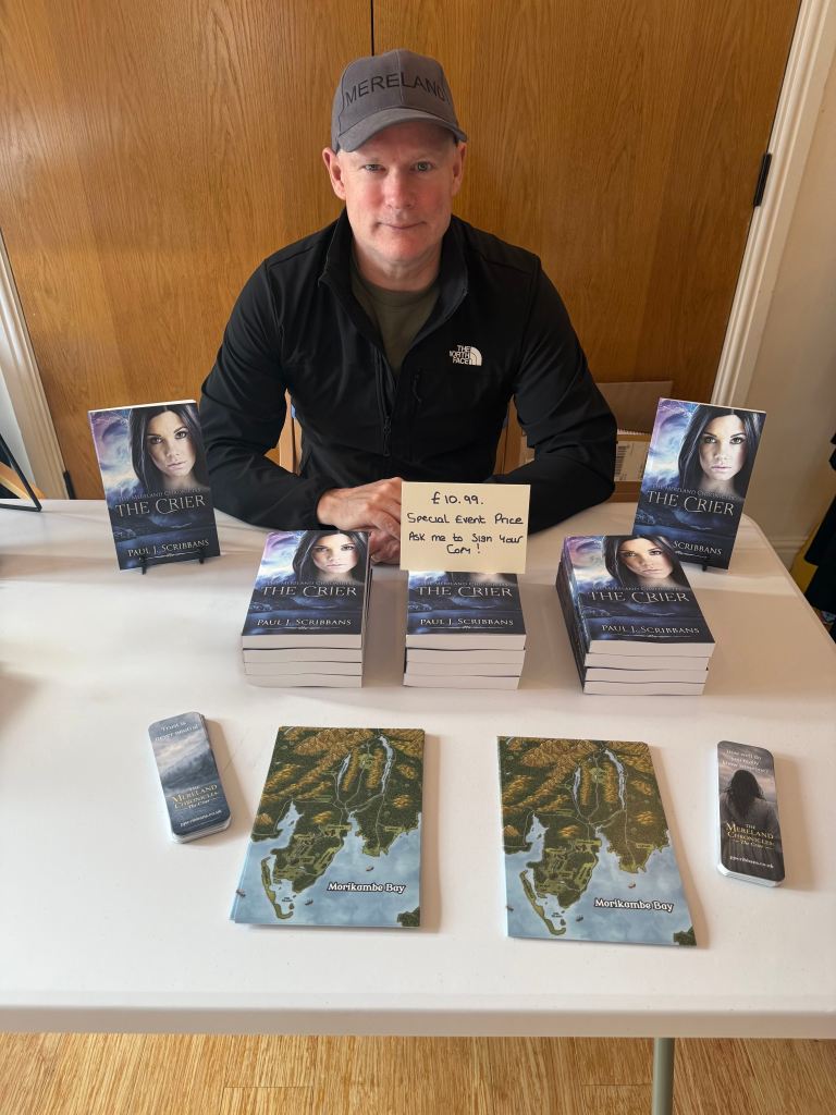 P.J. Scribbans at the Furness Book Fair at Swarthmoor Hall with copies of The Mereland Chronicles: The Crier.