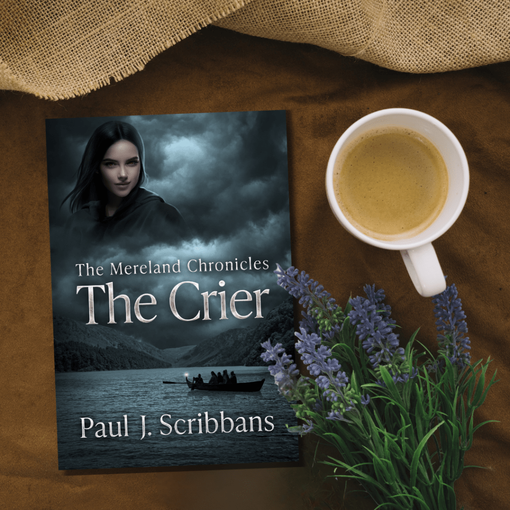 Promotional image of The Mereland Chronicles: The Crier by Paul J. Scribbans displayed on a tabletop beside a cup of coffee and sprigs of heather.